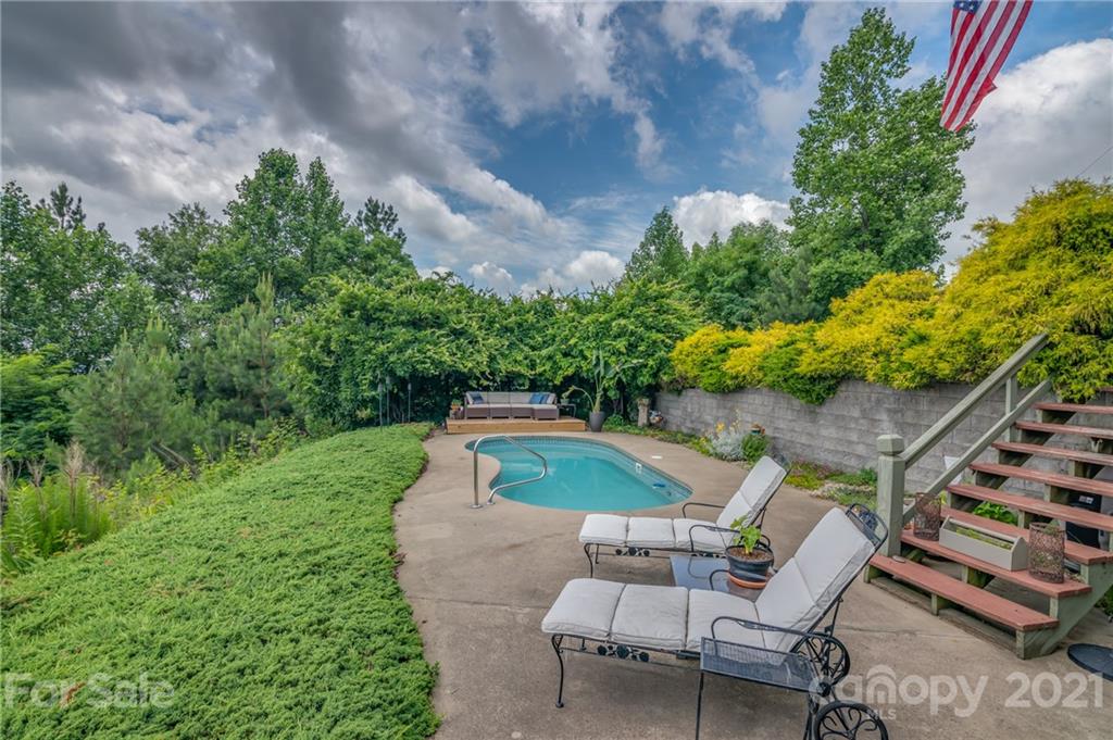 281 Big Rock Road Bostic, NC 28018 - Photo 38 of 48 a backyard of a house with table and chairs