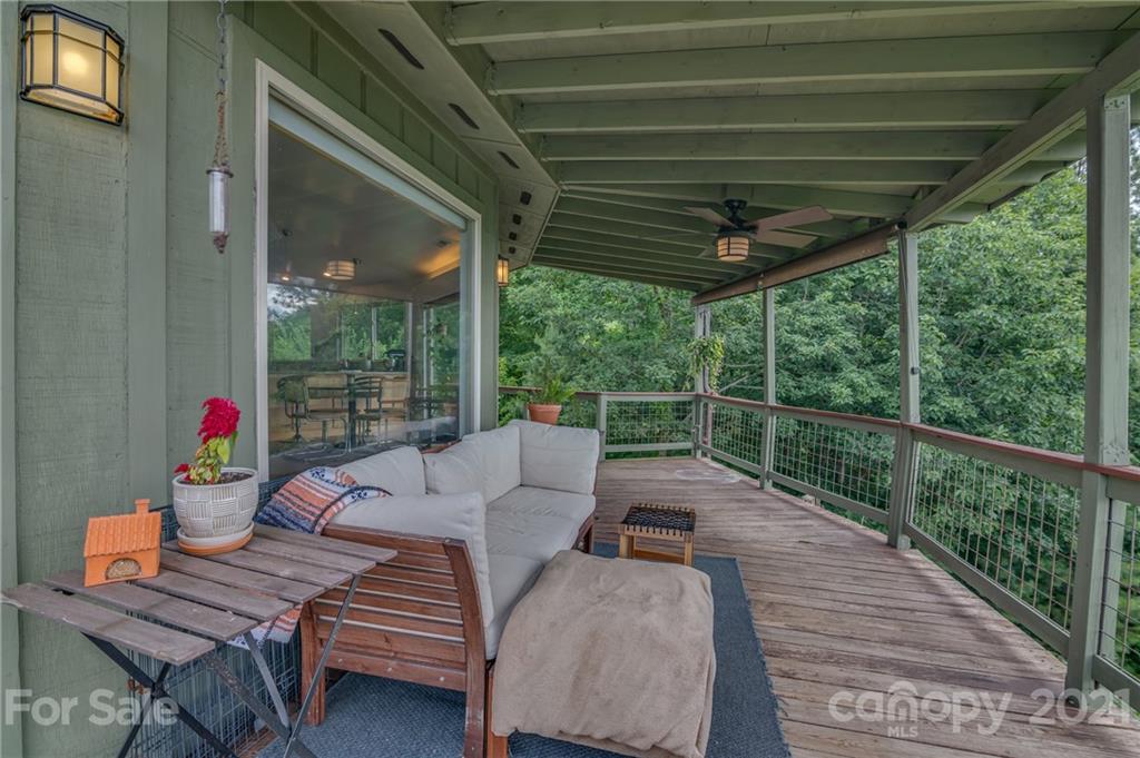 281 Big Rock Road Bostic, NC 28018 - Photo 41 of 48 a balcony with furniture and wooden floor