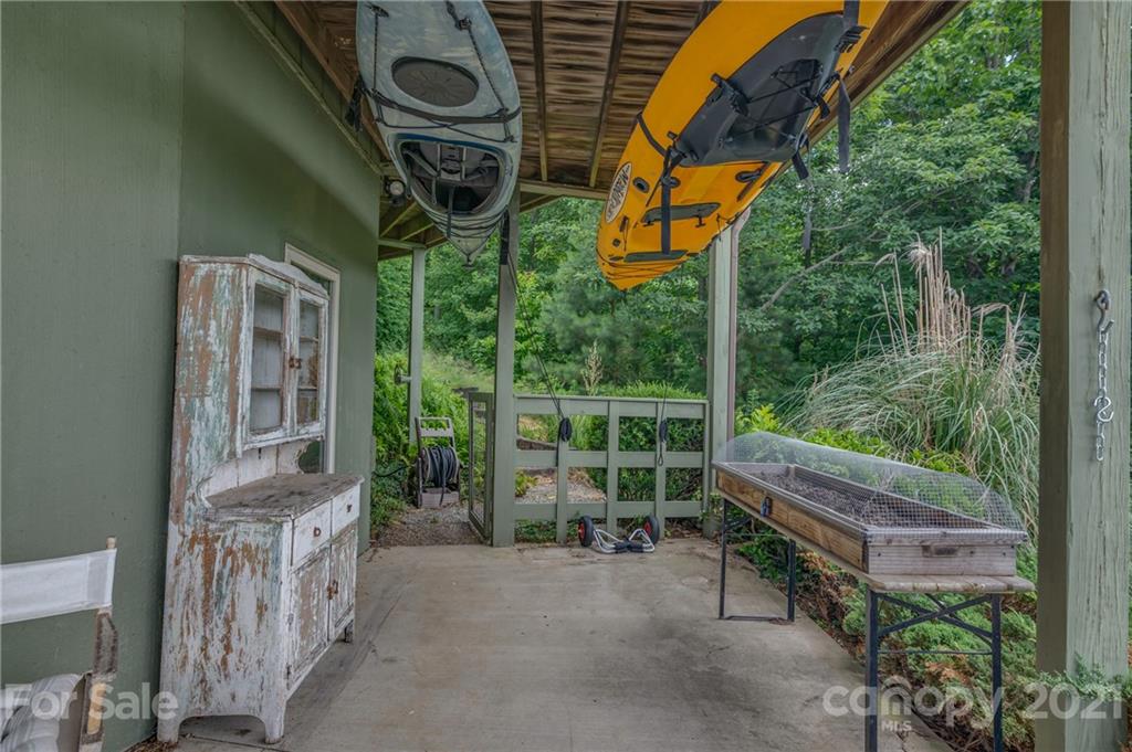 281 Big Rock Road Bostic, NC 28018 - Photo 42 of 48 a backyard of a house with wooden floor and outdoor seating
