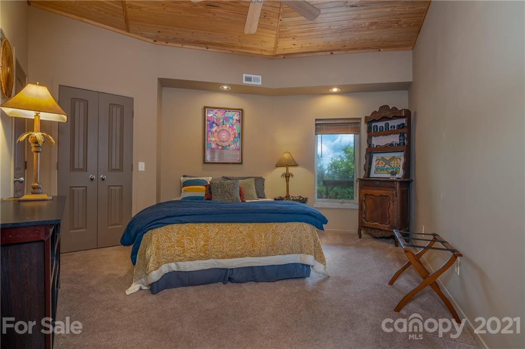 281 Big Rock Road Bostic, NC 28018 - Photo 9 of 48 a bedroom with a bed and a desk in it