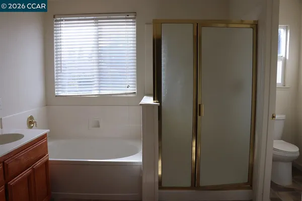 a bathroom with a bathtub and a window