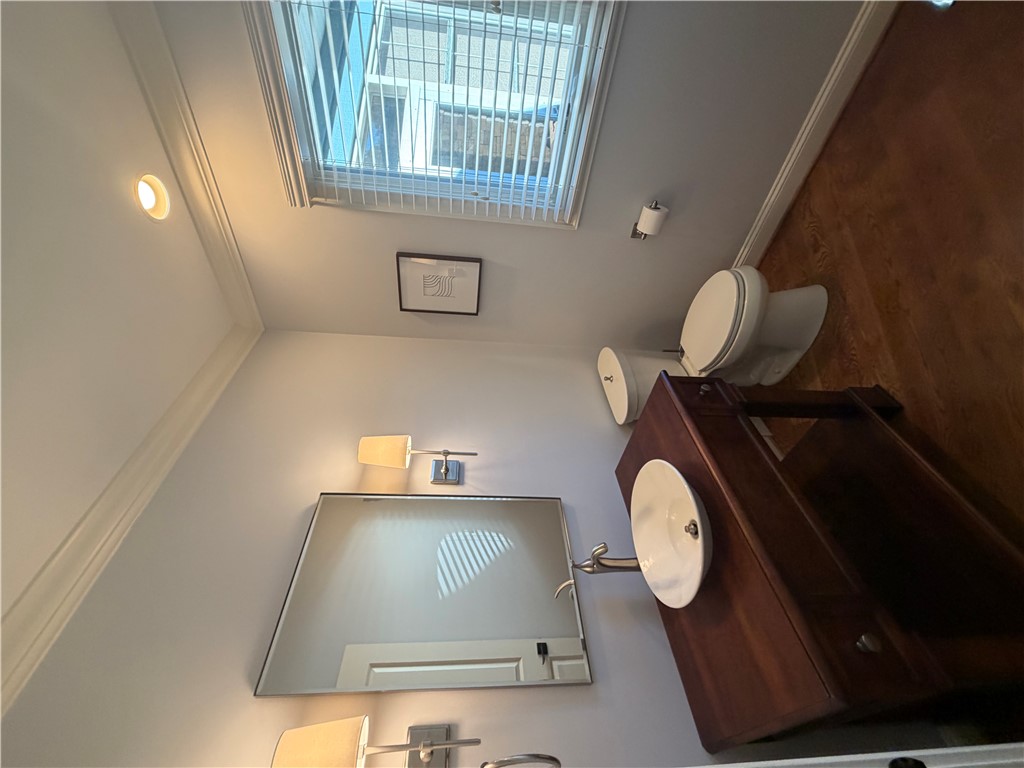 357 Stardust Lane Seneca, SC 29672 - Photo 27 of 50 Powder Room - Crown molding and rich wood flooring elevate this elegant powder room.