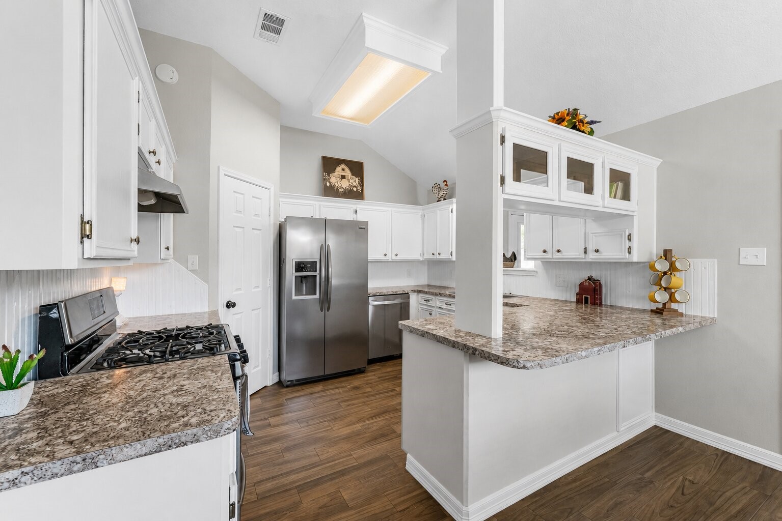 606 Walnut Street Sweeny, TX 77480 - Photo 9 of 28 a kitchen with stainless steel appliances granite countertop a refrigerator and a stove