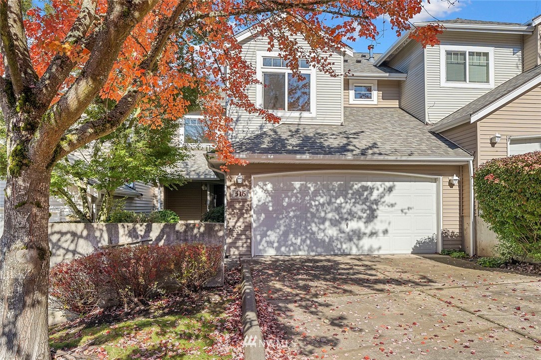 516 South 46th Place, Unit 516 Renton, WA 98055 - Photo 2 of 25 a view of a house with a yard