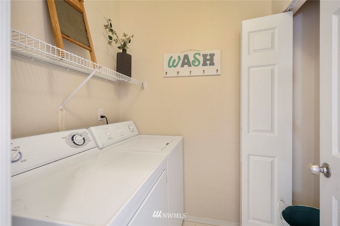 516 South 46th Place, Unit 516 Renton, WA 98055 - Photo 23 of 25 a utility room with dryer and washer