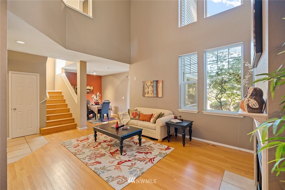 516 South 46th Place, Unit 516 Renton, WA 98055 - Photo 4 of 25 a living room with furniture and wooden floor