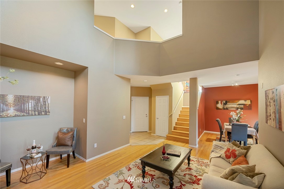 516 South 46th Place, Unit 516 Renton, WA 98055 - Photo 7 of 25 a living room with furniture and wooden floor