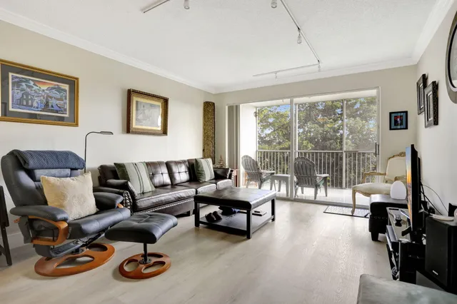 a view of a livingroom with workspace and a couch