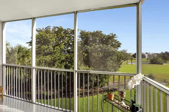 a view of a balcony with ocean view
