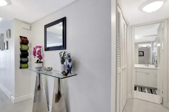 a bathroom with a sink vanity and mirror