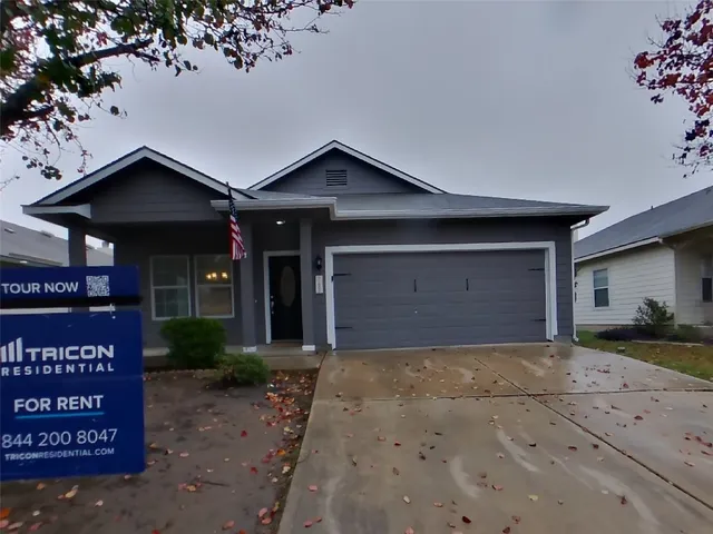 a view of a house with a garage