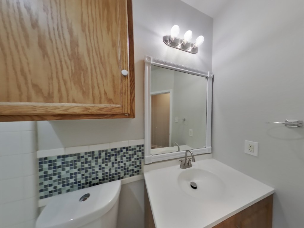 11602 Morgan's Point Street Manor, TX 78653 - Photo 15 of 17 a bathroom with a sink a toilet and shower