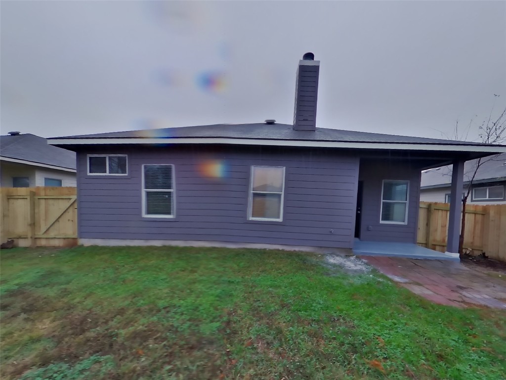 11602 Morgan's Point Street Manor, TX 78653 - Photo 16 of 17 a brick house with a yard