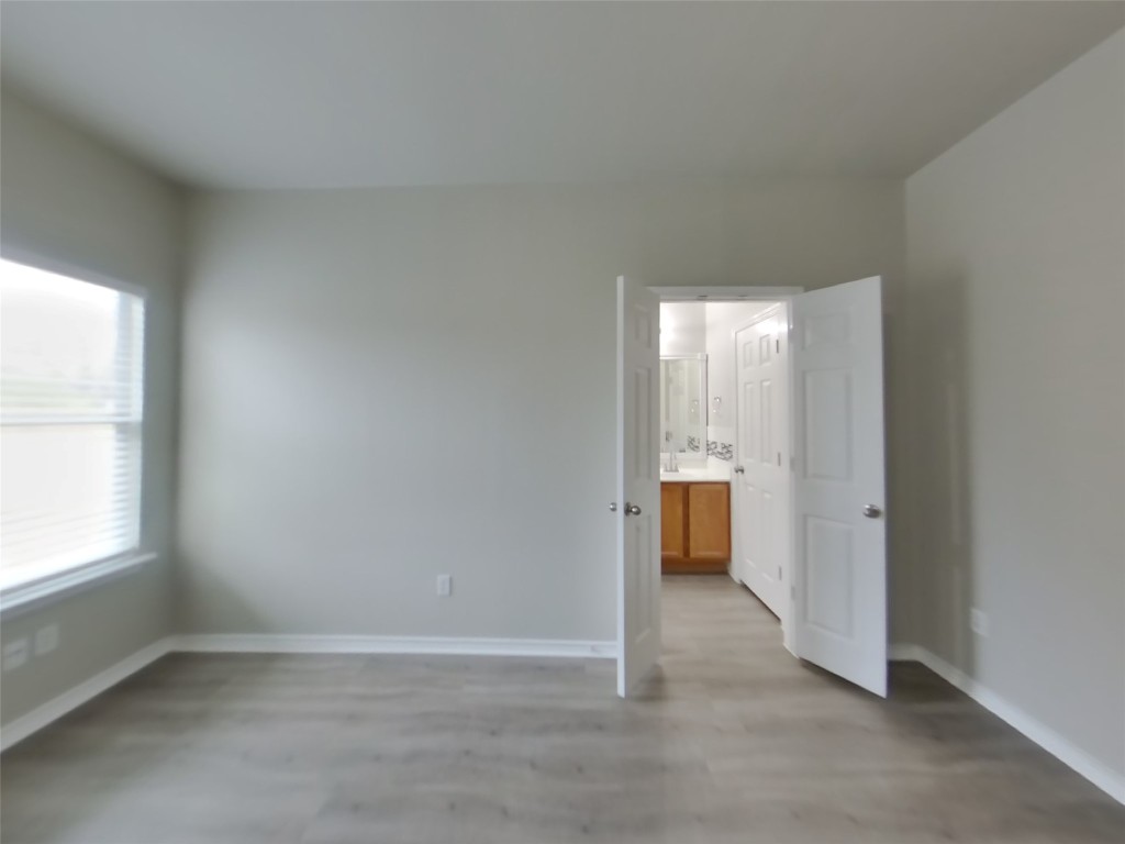 11602 Morgan's Point Street Manor, TX 78653 - Photo 9 of 17 an empty room with an entryway and window