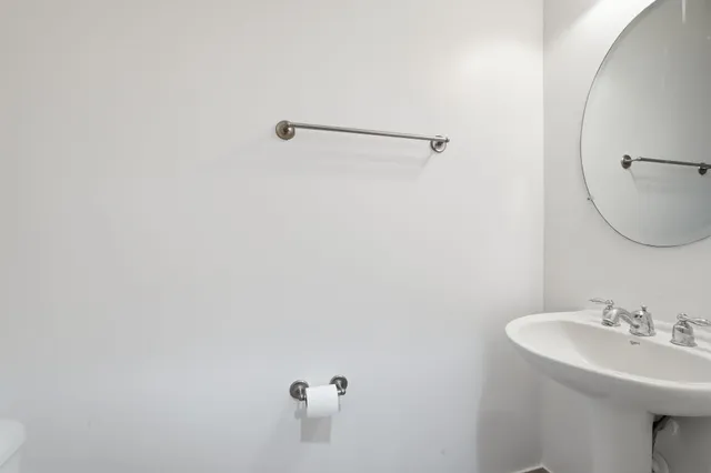 a bathroom with a sink and mirror