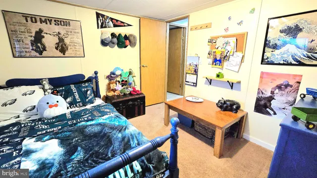 a bedroom with furniture and a bed