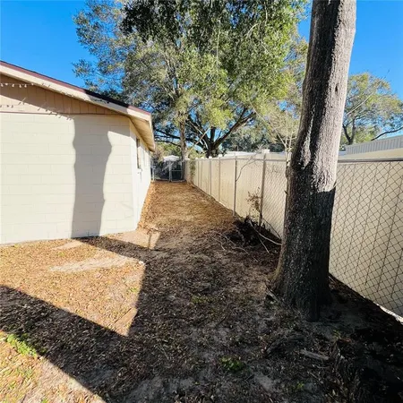 a view of a backyard of the house