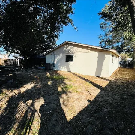a backyard of a house with lots of green space
