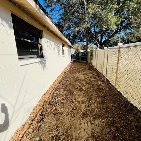 a view of a backyard of the house