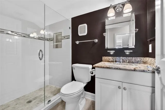 a view of a chair and table in backyard of the house