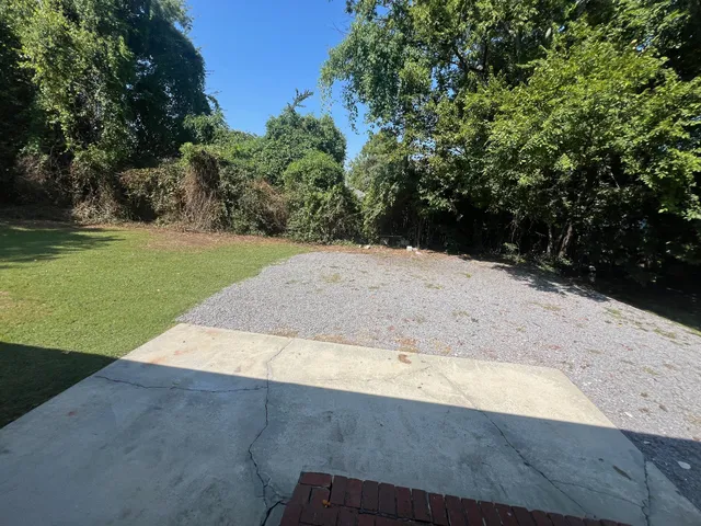 a view of a backyard of the house