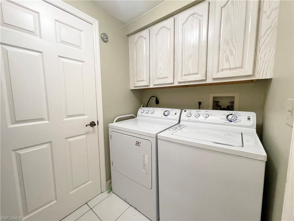 13105 Vanderbilt Drive, Unit 802 Naples, FL 34110 - Photo 13 of 32 a utility room with dryer and washer