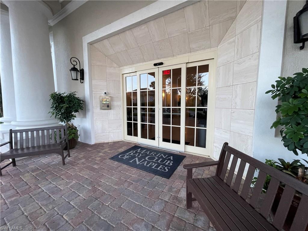 13105 Vanderbilt Drive, Unit 802 Naples, FL 34110 - Photo 18 of 32 a view of a porch with furniture