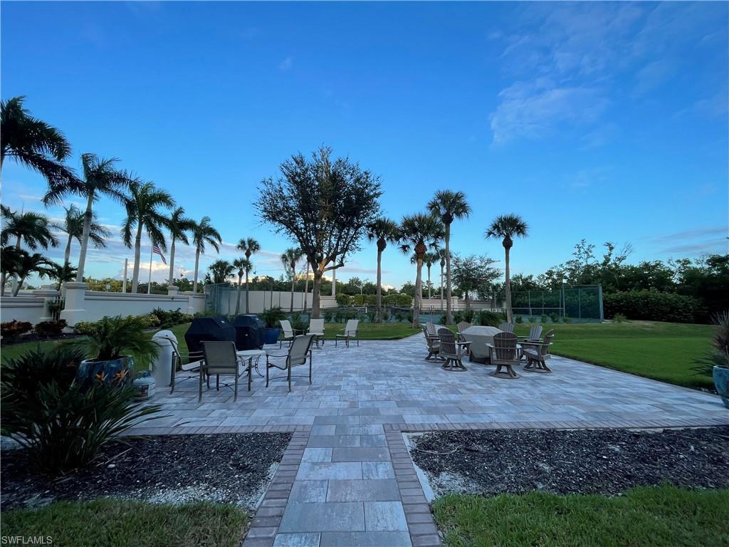 13105 Vanderbilt Drive, Unit 802 Naples, FL 34110 - Photo 28 of 32 a view of a park with sitting area