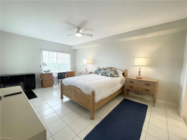 a bedroom with a bed and a walk in closet