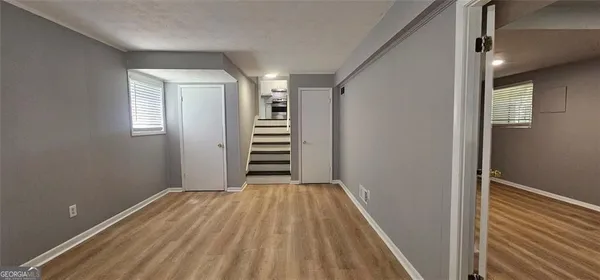 a bathroom with a double vanity sink toilet and a mirror
