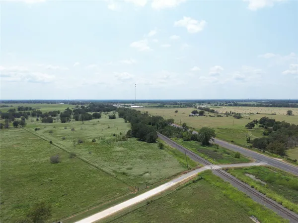 an aerial view of a houses with outdoor space