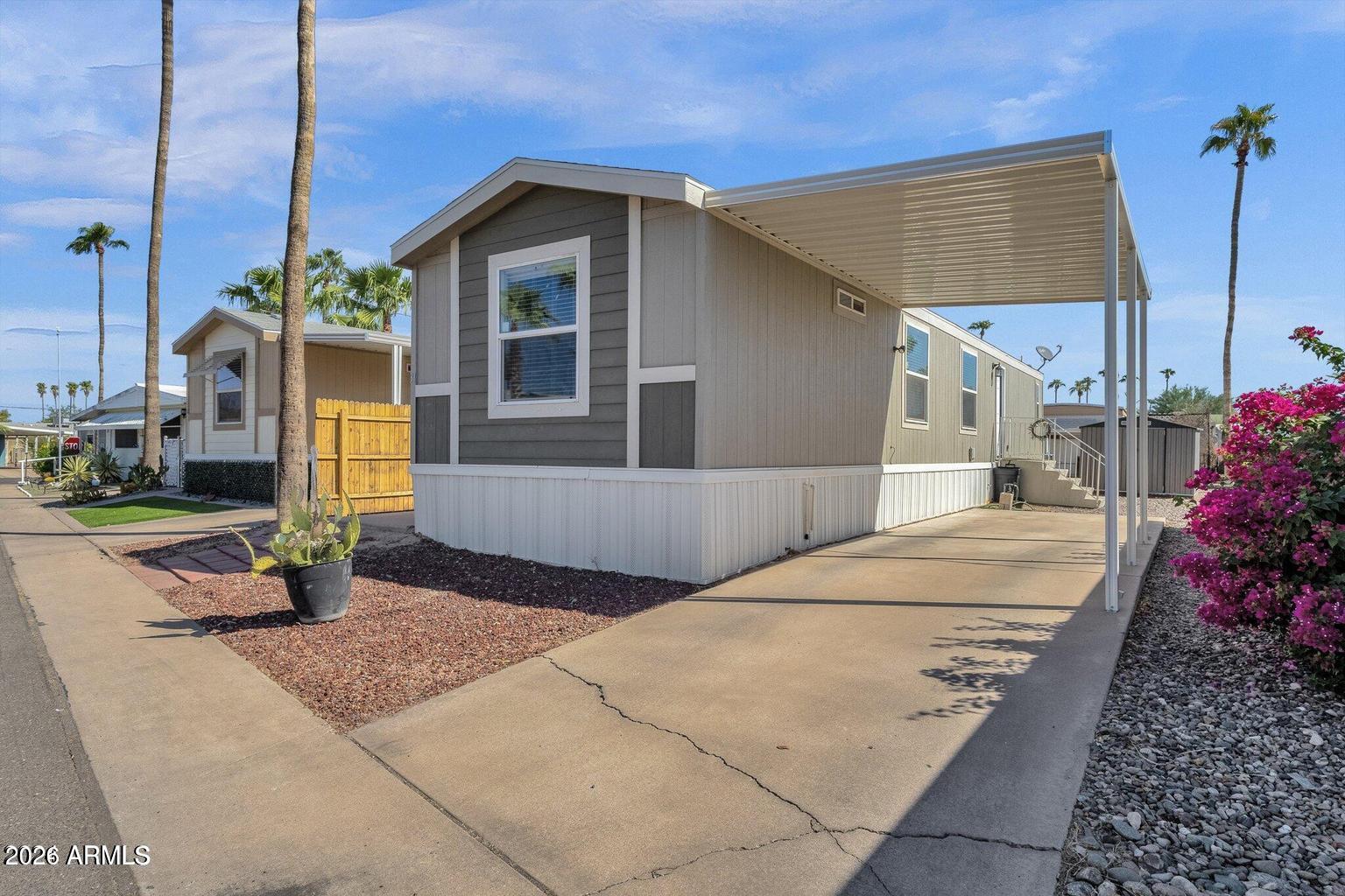 a front view of a house with a garden