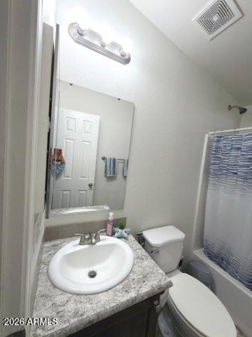 16225 North Cave Creek Road, Unit 31 Phoenix, AZ 85032 - Photo 16 of 33 a bathroom with a granite countertop toilet sink and mirror