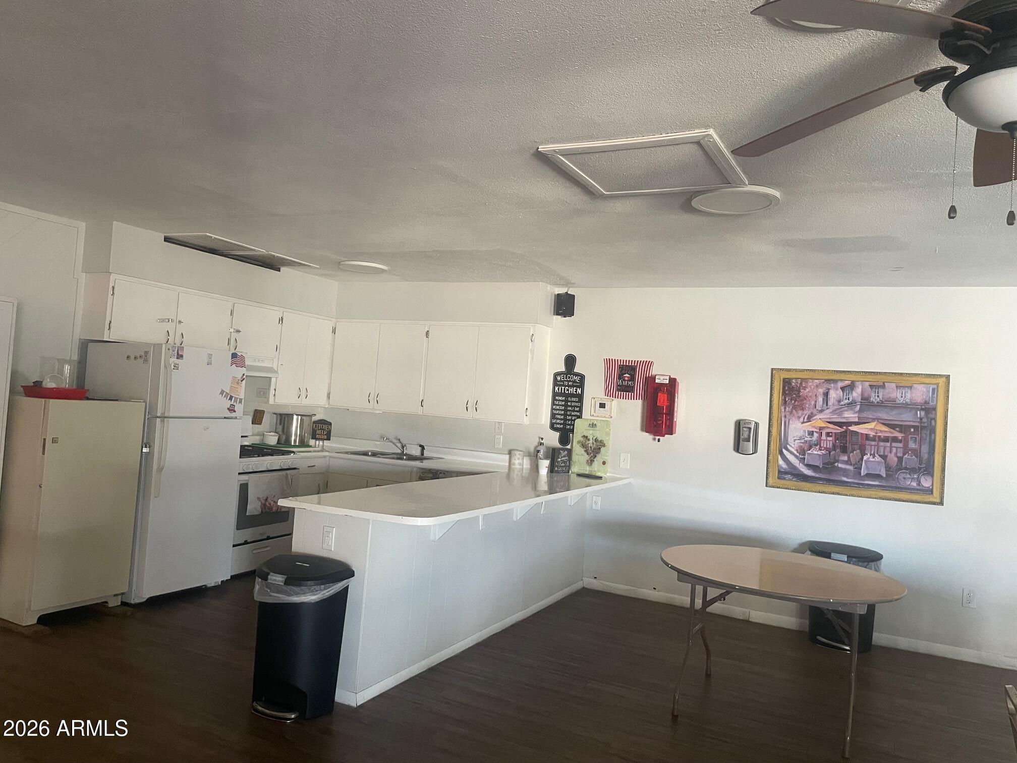 16225 North Cave Creek Road, Unit 31 Phoenix, AZ 85032 - Photo 21 of 33 a kitchen with a refrigerator and a stove