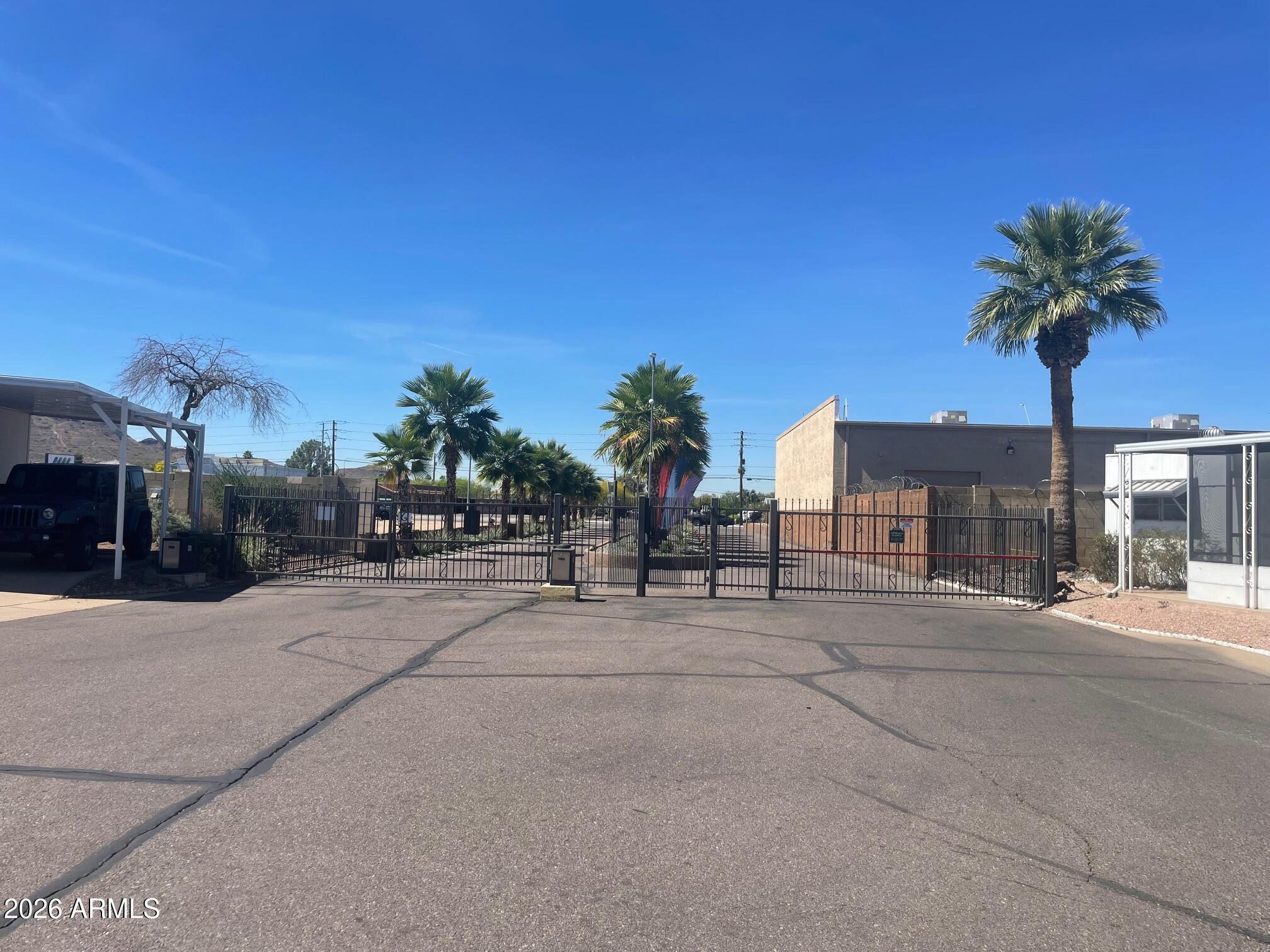 16225 North Cave Creek Road, Unit 31 Phoenix, AZ 85032 - Photo 28 of 33 a couple of cars parked in front of a building