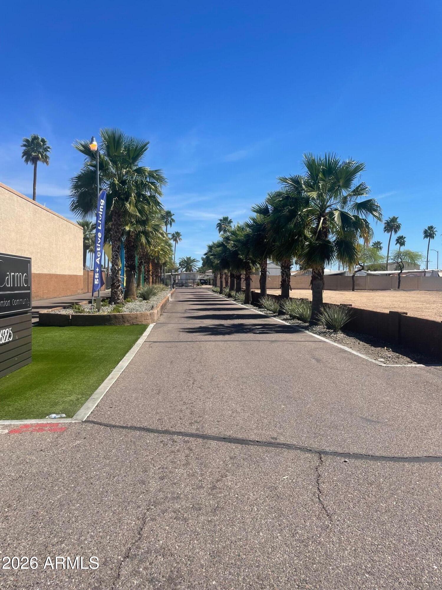 16225 North Cave Creek Road, Unit 31 Phoenix, AZ 85032 - Photo 29 of 33 a view of a street with a cars parked in front of it