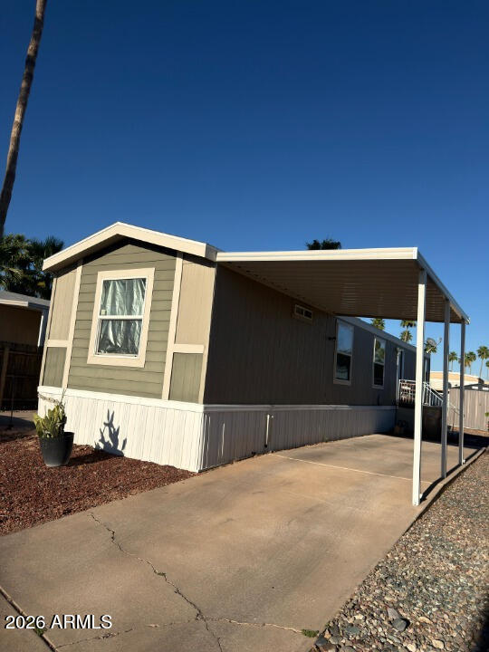 16225 North Cave Creek Road, Unit 31 Phoenix, AZ 85032 - Photo 4 of 33 a front view of a house with a garage