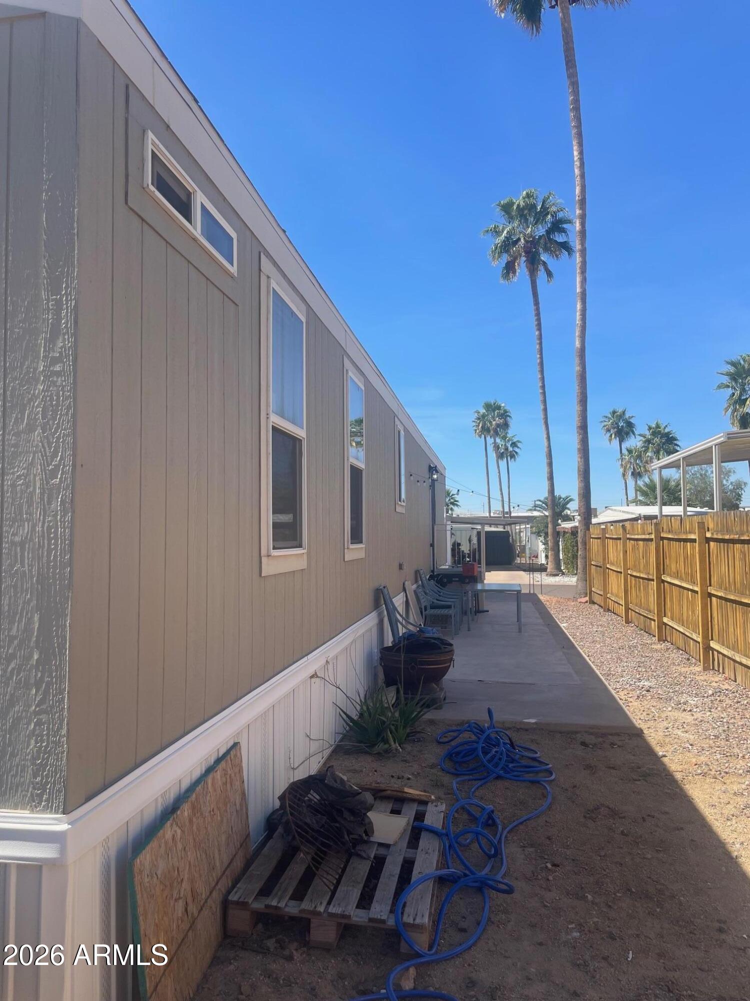 16225 North Cave Creek Road, Unit 31 Phoenix, AZ 85032 - Photo 5 of 33 a view of a porch with furniture and a yard