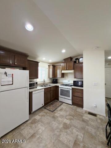 16225 North Cave Creek Road, Unit 31 Phoenix, AZ 85032 - Photo 8 of 33 a kitchen with stainless steel appliances and white cabinets