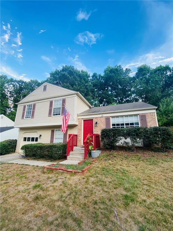 330 Knoll Ridge Court Alpharetta, GA 30022 - Photo 1 of 1 a front view of a house with garden