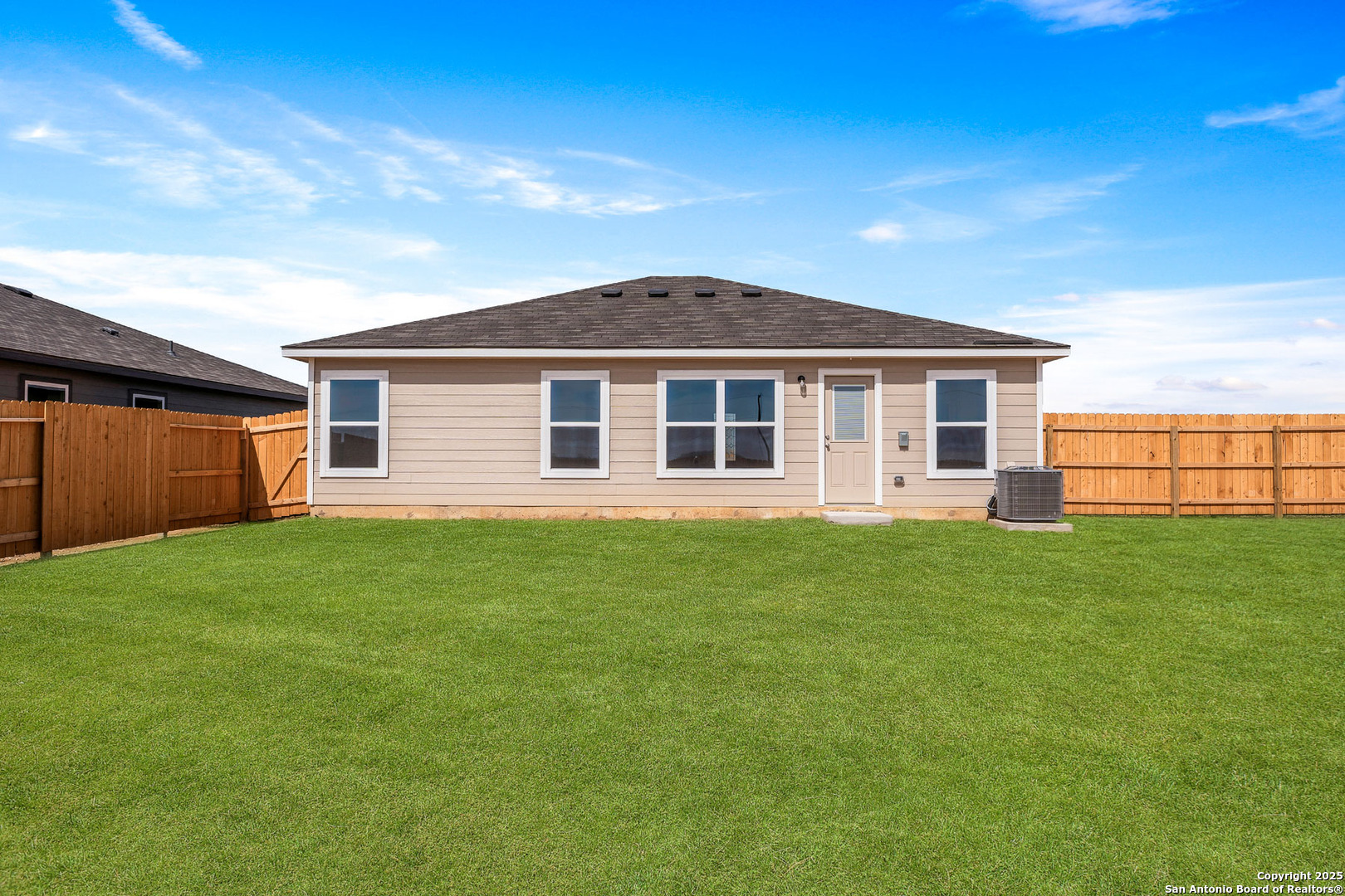 16025 Stratford Cove Lytle, TX 78052 - Photo 2 of 24 a front view of a house with a garden