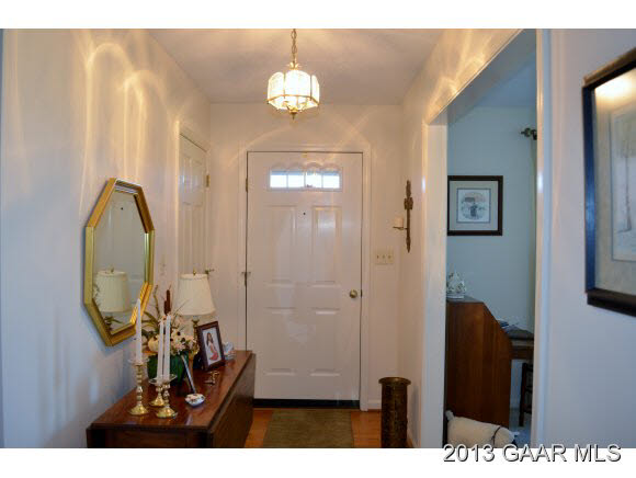 643 Old White Bridge Road Waynesboro, VA 22980 - Photo 2 of 15 a view of a hallway with wooden floor and living room