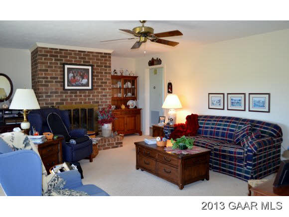 643 Old White Bridge Road Waynesboro, VA 22980 - Photo 6 of 15 a living room with furniture a fireplace and a chandelier