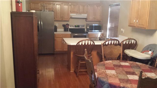1847 Cairo Road Gallatin, TN 37066 - Photo 5 of 17 Eat in Kitchen with oak floors and dining area looking into the living room area.