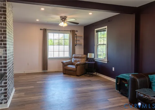 a living room with furniture and a window