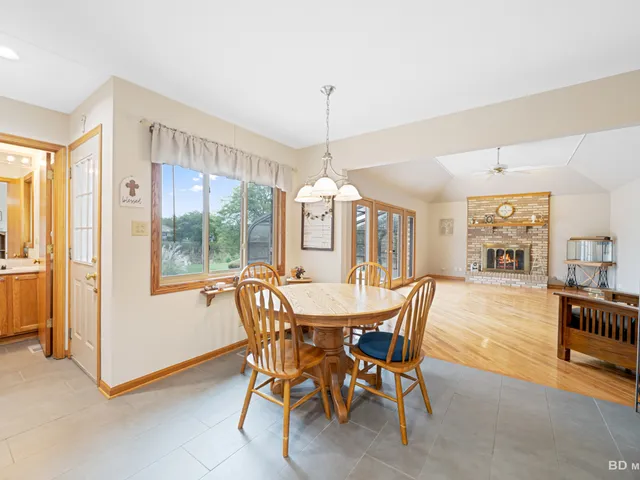 a dining room with furniture window and outside view