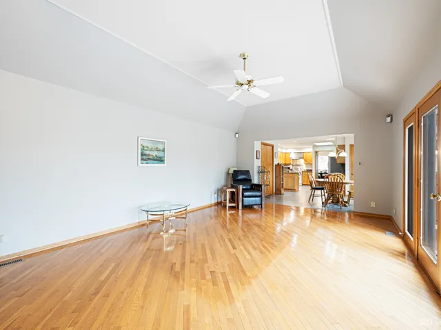 a view of a livingroom with furniture and a flat screen tv