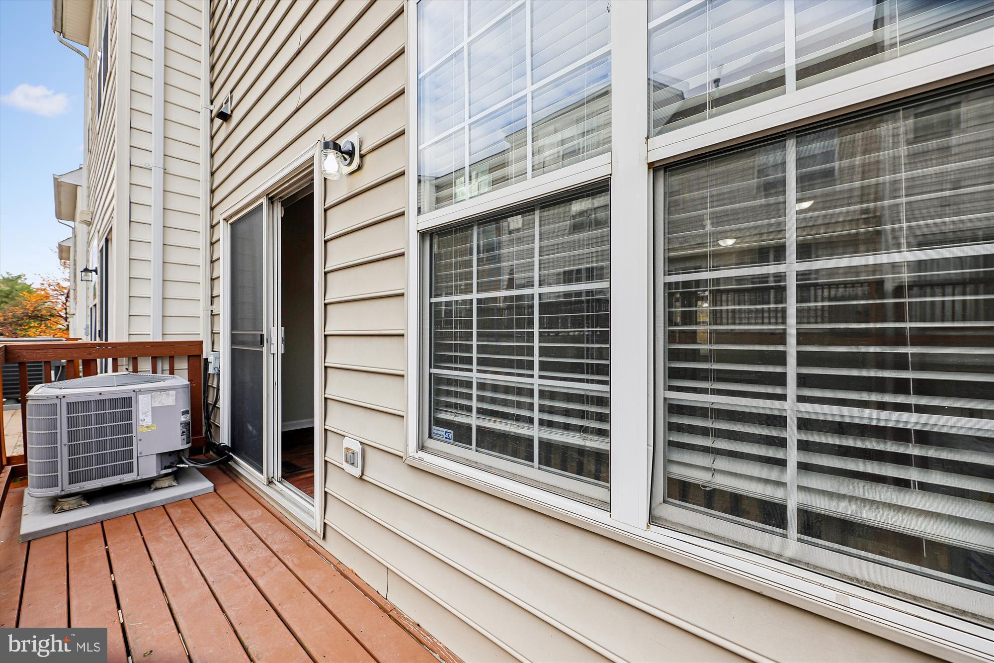 3811 Eisenhower Avenue Alexandria, VA 22304 - Photo 12 of 56 a view of a balcony with a floor to ceiling window