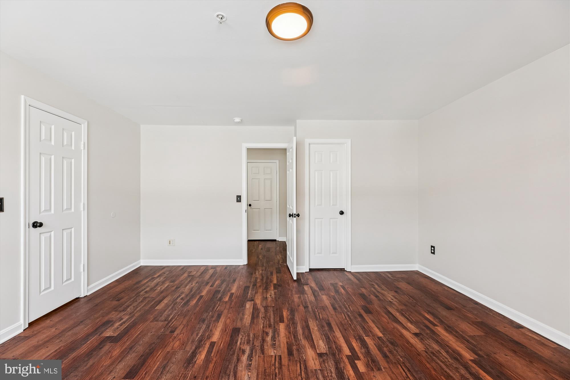 3811 Eisenhower Avenue Alexandria, VA 22304 - Photo 23 of 56 a view of a room with wooden floor and window