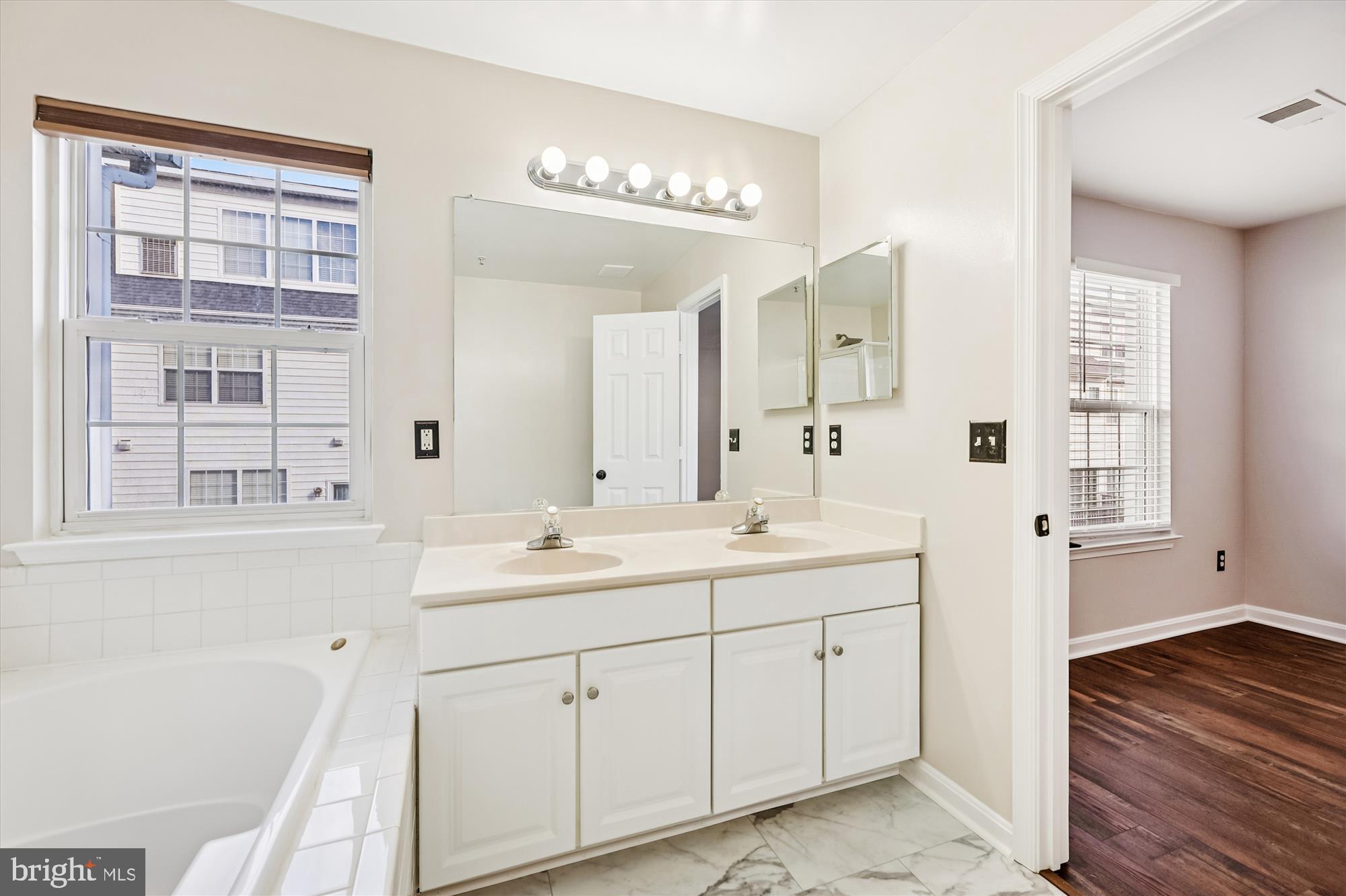 3811 Eisenhower Avenue Alexandria, VA 22304 - Photo 25 of 56 a spacious bathroom with a double vanity sink a mirror and a